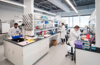 Two Men and a Woman in Isolere Bio Lab